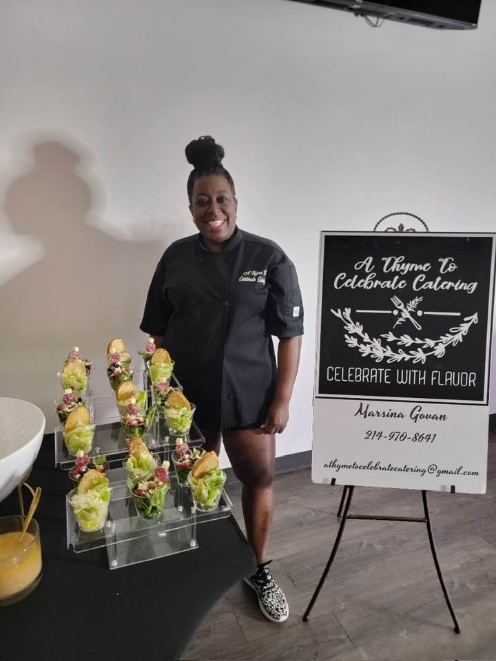 Chef Marsina Govan in her chef's coat with signature dishes